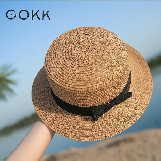 COKK Panama Sommerhut für Damen – Schlichte Strandmütze mit Flachrand und Schleife, Stroh Cap für Sonne und Freizeit